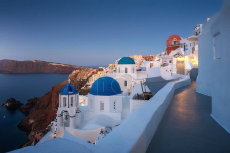 Photo for Paradise found in Santorini! This iconic image showcases the island's stunning blue domes, white houses, rugged caldera, and endless sea. - Royalty Free Image