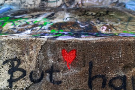 Photo for A spry painted graffiti heart on a wall in Maribor city. Someone expressed his love by doing that. The wall is under a train bridge. There are a lot of graffiti artwork, but this heart stand out - Royalty Free Image