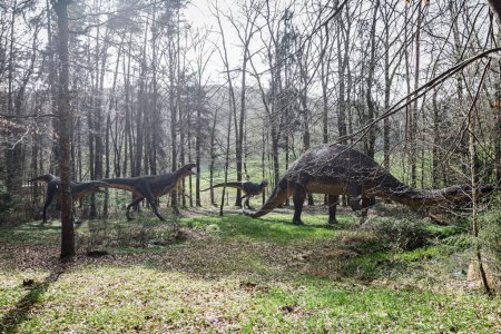 A dinosaur replica in a forest