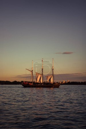 Sailing ship on Lake Ontario at sunset, Canada.