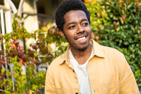 Photo for Portrait of young African American man smiling and looking away. High quality photo - Royalty Free Image