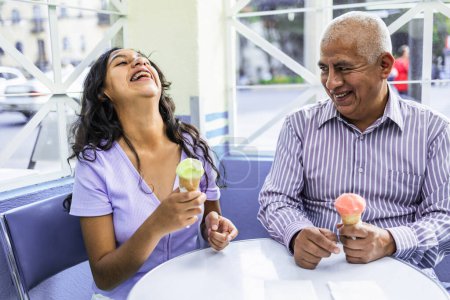 Photo for Teenager and her grandfather eating ice cream indoors. High quality photo - Royalty Free Image