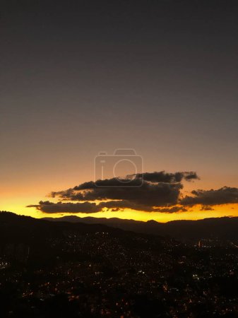 Purple sunset with orange and big clouds. Medellin, Antioquia, Colombia.