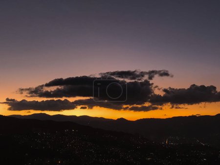 Purple sunset with orange and big clouds. Medellin, Antioquia, Colombia.