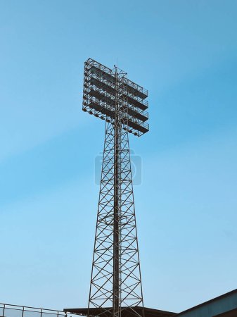 Photo for Itagui, Antioquia, Colombia. February 12, 2024: Ditaires stadium big led light with blue sky and lightning in the sky. - Royalty Free Image