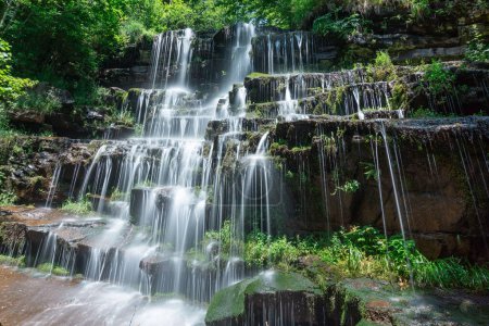 Long exposure photo majestic waterfall tupavica in lush green forest scenery stara planina mountain