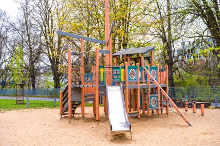 Wooden playground Ship with slide and sand in spring in Prague Liben. High quality photo