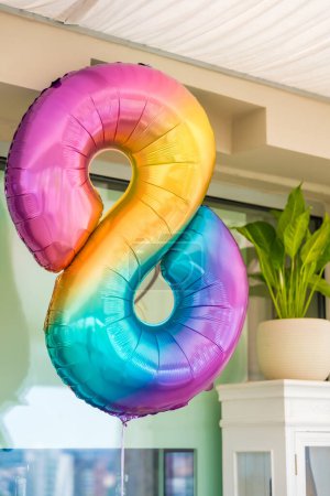 Rainbow helium balloon number eight. Birthday concept. High quality photo