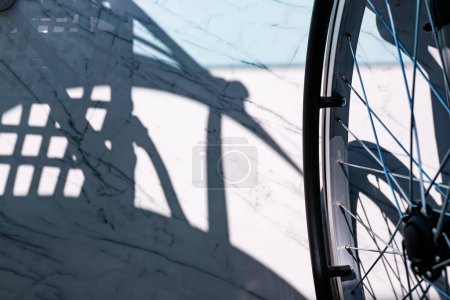 Photo for Rear view of a wheelchair with shadows in Villajoyosa - Royalty Free Image