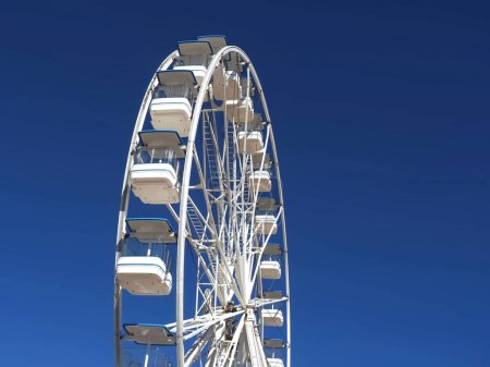 Photo for Huge white ferris wheel with blue sky - Royalty Free Image