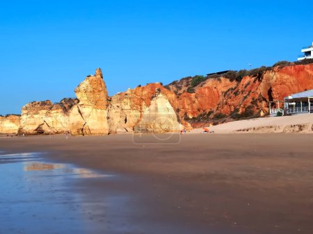 Photo for Beautiful Algarve beach landscape in Potimao Portugal with epic high red cliffs - Royalty Free Image