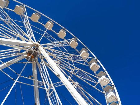 Huge white ferris wheel with blue sky