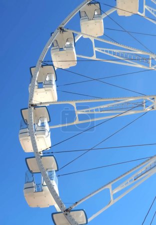 Photo for Huge white ferris wheel with blue sky - Royalty Free Image