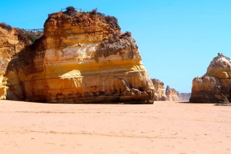 Photo for Beautiful Algarve beach landscape in Portimao Portugal with epic high red cliffs - Royalty Free Image