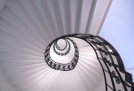 Spiral staircase Beautiful still life with black ornament railing top view