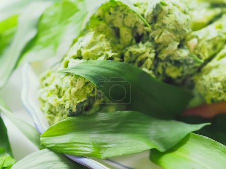 Photo for Wild carlic cooking Allium ursinum butter in a bowl - Royalty Free Image
