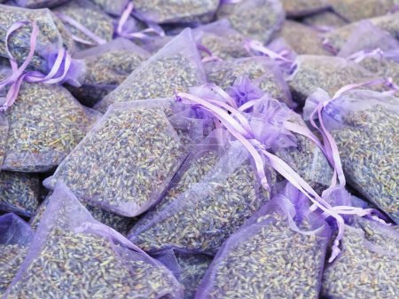 Photo for Many purple transparent bags with dried lavender - Royalty Free Image