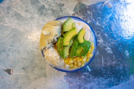 Mixed ice is one of the refreshing drinks that cannot be refused in hot weather, this dessert is called es teler with toppings of durian, corn, avocado and slice of coconut.