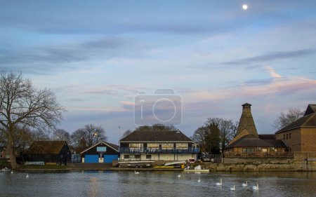 Photo for St Neots, UK - 17th March 2019: Dusk over St Neots rowing club and the oast house on a beautiful spring evening. High quality photo - Royalty Free Image