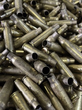 spent bullet cases in a random heap. High quality photo