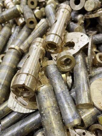close up of bronze rods and scrap off cuts from a manufacturing process. High quality photo