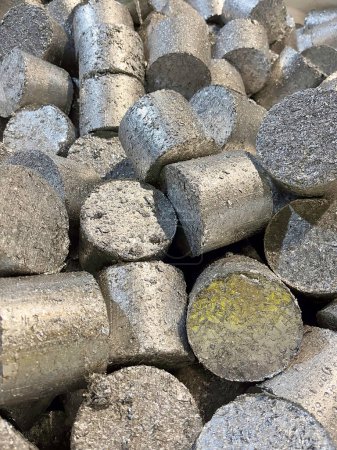 Aluminium briquettes of compressed turnings a waste product from machining components. High quality photo
