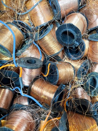 Small copper coils on plastic spools ready to be recycled. High quality photo