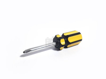Yellow mini screwdriver, isolated white background, made of iron and plastic