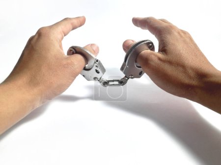 thumb of a man in handcuffs