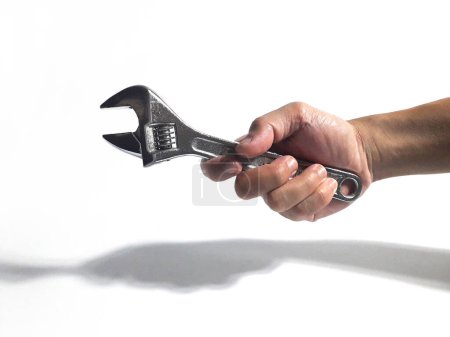 adjustable wrench being held by someone 2