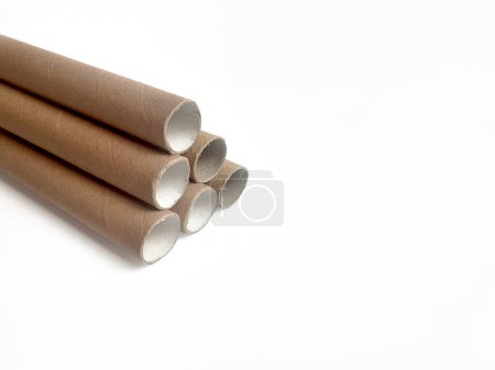 Photo for Cardboard tube pipes used in packing shipping goods on a white background - Royalty Free Image