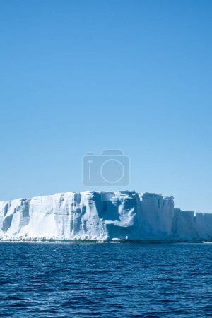 Photo for Huge blue tabular iceberg drifting in the Weddell Sea east of the Antarctic Peninsula, Antarctica - Royalty Free Image