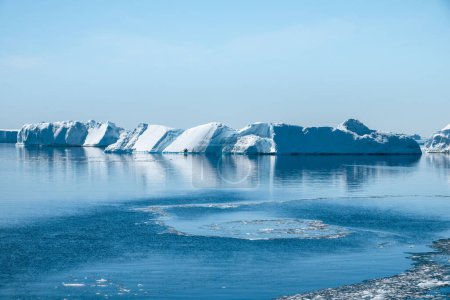 Photo for Calm waters of the Weddell Sea and blue icebergs in summer - Royalty Free Image