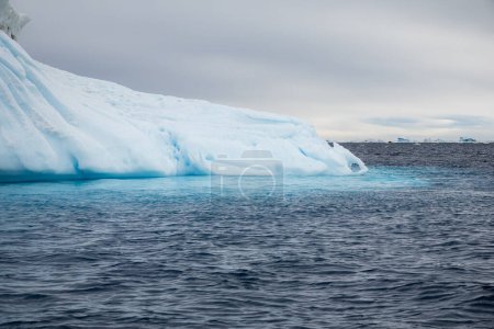 Photo for Beautiful iceberg and blue reflection in the sea - Royalty Free Image
