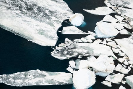 Aerial photograph of the icebergs of different sizes and shapes (from growlers to very large) broken off from the Ross Ice Shelf of Antarctica
