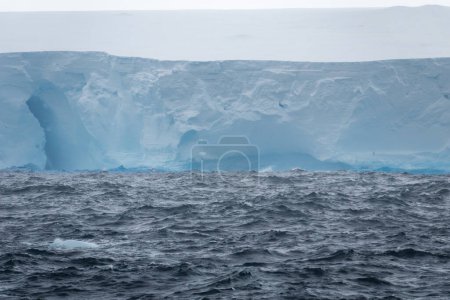Photo for 400 meters high tabular iceberg drifting in the Weddell Sea towards the South Shetland Islands, Antarctica - Royalty Free Image