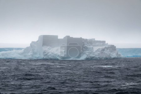 Photo for Castle-shaped iceberg calved off the A23a iceberg, both drifting in the Weddell Sea towards the Scotia Sea - Royalty Free Image