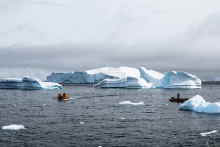 Photo for Palaver Point, Antarctic Peninsula - December 14, 2023 - Inflatable zodiac boats of Quark Expeditions are cruising in the Graham Passage, Antarctica - Royalty Free Image