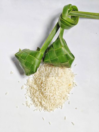 Ayamana ketupat and rice on a white background