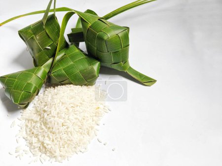 Ayamana ketupat and rice on a white background