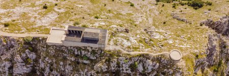 Photo for BANNER, LONG FORMAT Montenegro. Lovcen National Park. Mausoleum of Negosh on Mount Lovcen. Drone. Aerial view. Viewpoint. Popular tourist attraction. Petar II Petrovic-Njegos mausoleum on the top of - Royalty Free Image