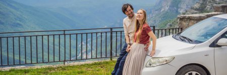 Photo for BANNER, LONG FORMAT Happy couple tourists on background of Blue river running through green valley toward distant mountains. Beautiful mountains of Montenegro and the river Cievna. - Royalty Free Image