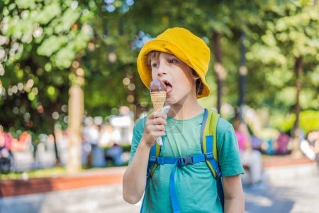 Photo for Boy tourist boy eating turkish ice cream. - Royalty Free Image