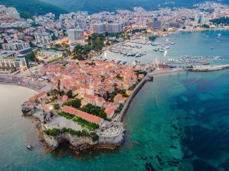 Photo for Budva city lights from Montenegro seen from above. Night view. Drone old town Budva at night. - Royalty Free Image
