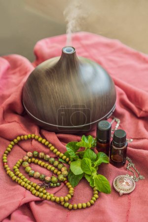 A captivating photo capturing the essence of relaxation and ambiance with an aroma oil and aroma diffuser, creating a soothing and serene atmosphere.