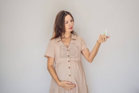 Photo for Confident and radiant pregnant woman over 40 showcasing the debate on pregnancy and deodorant. Is it good or bad for expectant mothers. Embrace the journey with safe and gentle options. - Royalty Free Image