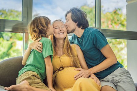 Photo for Expectant parents, mom, dad, and their eldest son share a heartwarming moment on the sofa, discussing the exciting journey of pregnancy. - Royalty Free Image