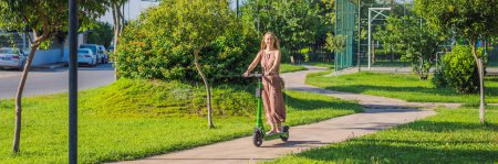 BANNER, LONG FORMAT Young beautiful woman riding an electric scooter to work, modern girl, new generation, electric transport, ecology, ecological transport, sunset, electric skateboard.