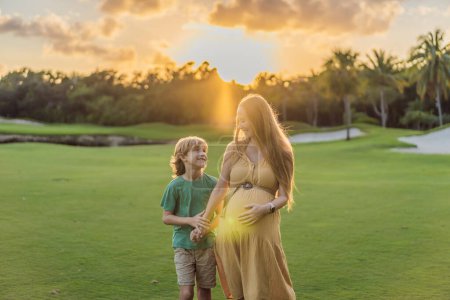 Heartwarming outdoor bonding as a pregnant mom and her son enjoy quality time together, savoring the beauty of nature and creating cherished moments.