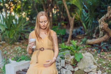 A pregnant woman doubts whether she should drink coffee during pregnancy.